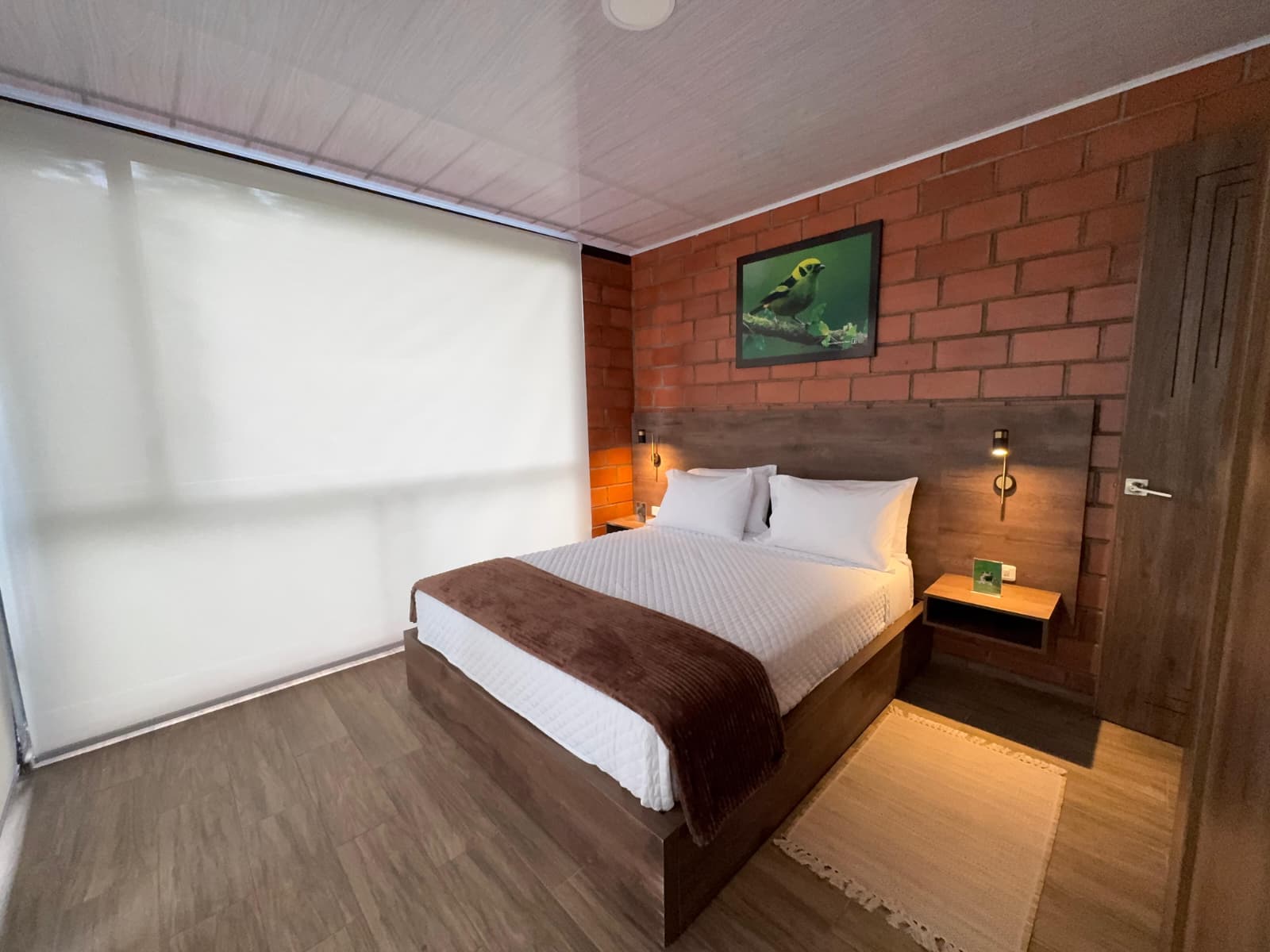 Warm-lit master bedroom, luxury cloud forest cabin Mashpi